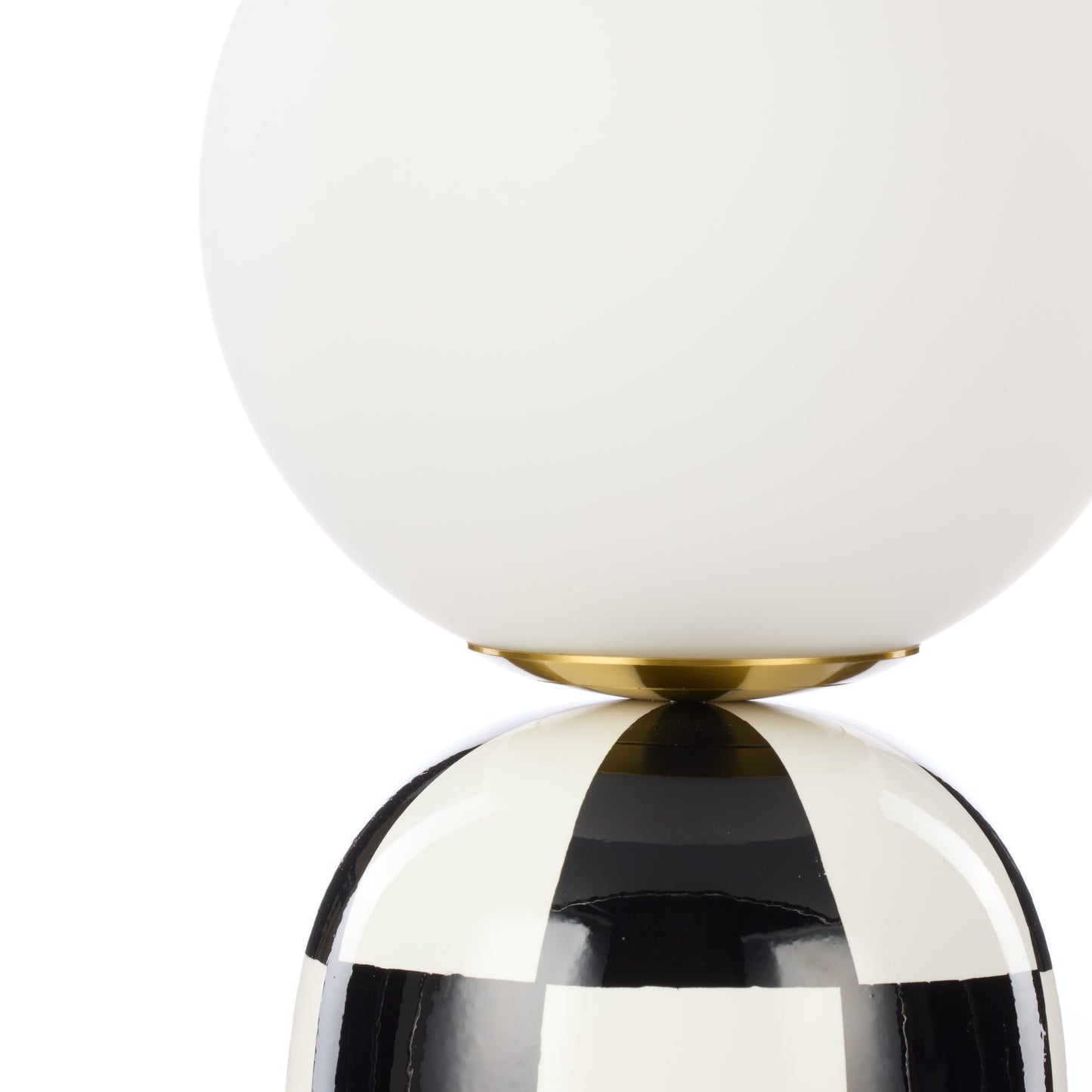 Close-up of Archie black and white table lamp glass shade and ceramic base