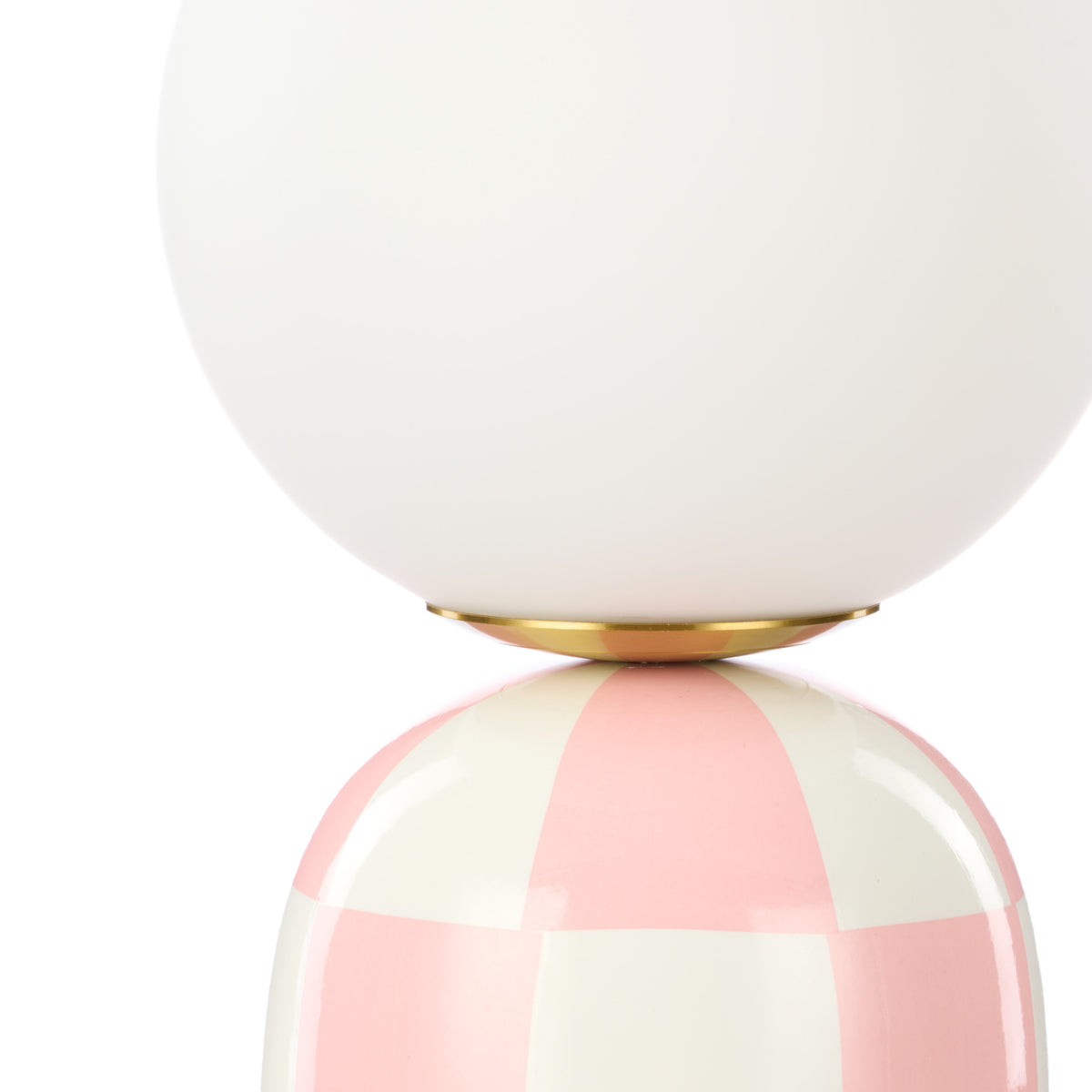 Close-up of Archie pink and white table lamp glass shade and ceramic base