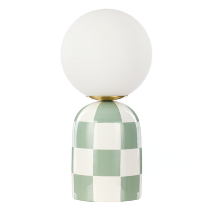 Archie green and white checkerboard table lamp with round glass shade