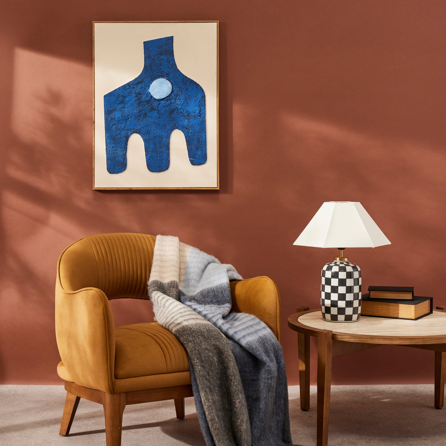 Haynes checkerboard table lamp styled beside a mustard armchair